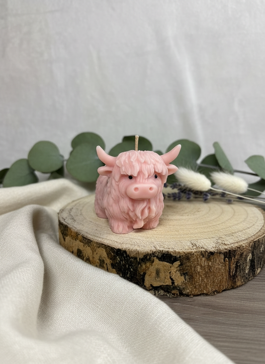 Pink Soy Highland Cow Candle in soft setting